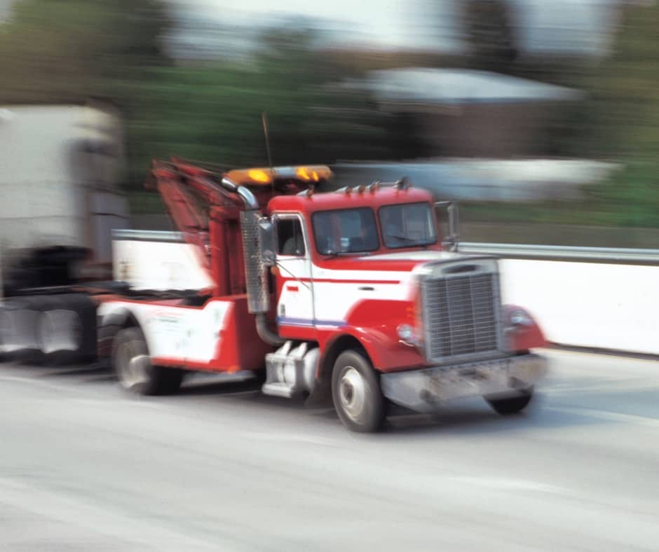 Calgary recovery tow truck pulling a vehicle out of a ditch