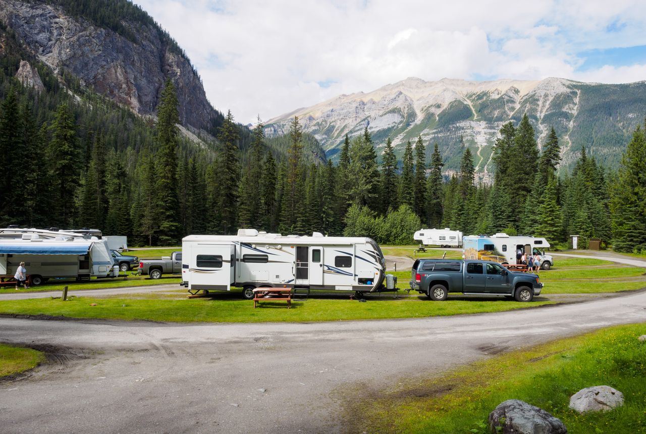 RVs and travel trailers parked at a mountain campsite near Calgary